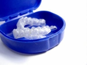 Two teeth whitening trays in a blue case